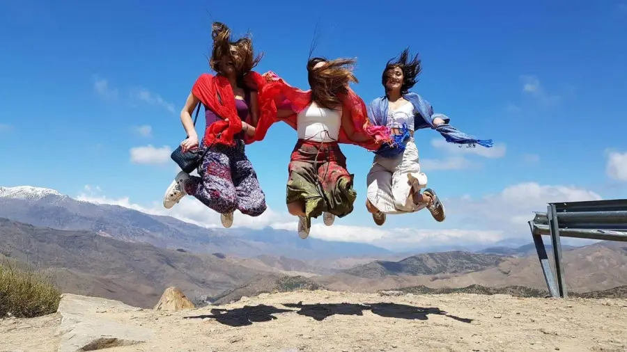 Friends jumping in the Atlas Mountains